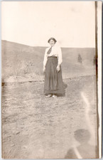 c1909 Woman Standing on Rural Hillside RPPC Postcard Scenic Outdoor Portrait picture