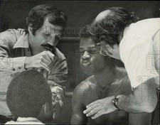 1974 Press Photo Boxer James Scott gets instruction from coach during time out picture