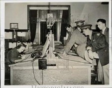 1942 Press Photo Capt. James Chapman checks weather report at a British airfield picture