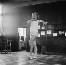 Actress Dora Bryan rehearsing a dance routine in a gymnasium for m- Old Photo picture