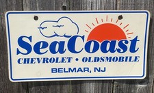 RARE SEACOAST DEALERSHIP LICENSE PLATE OLDSMOBILE CHEVY BELMAR, NEW JERSEY picture