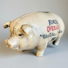 Finck's Overalls Pig 1885 Cast Iron Coin Bank picture