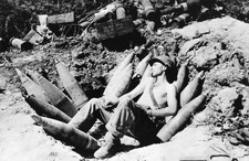 An American soldier sleeps on his ammunition in Mason area during - Old Photo picture