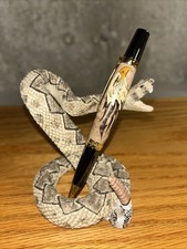 Realistic Ferocious Attacking Diamondback Rattlesnake With Fangs Bared Figurine picture