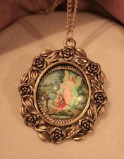 Lovely Rose Rimmed Goldtone Guardian Angel on Bridge Pendant Necklace picture