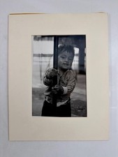 Vintage Black and White Photo Young Boy Holding Metal Pole Documentary Matted picture
