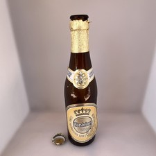 This is a bottle of Warsteiner Premium Verum Empty Bótale Made In Germány picture