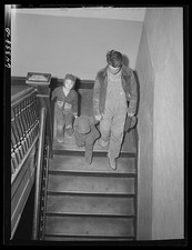 Photo:Chaffee, Missouri. Father and children leaving doctor's office picture