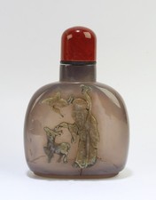 Chinese Amber Snuff Bottle, depicting a deity with an animal and a bird picture