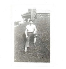 VTG B&W Found Small Snapshot Photo Pretty Girl in Pants Sitting on Grass Hill picture