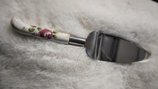 Vintage serrated edge cake pie server metal with floral pattern handle picture