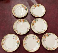 Set 7 Nippon Hand Painted 7.5” Dessert/Salad Plates Flowers Gold Detail 1900’s picture