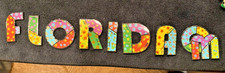 Odyssey of the Mind 2023 Florida Flower Patchwork Letters 8-Pin Set OM picture