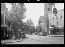 Photo:Main Street town center 1930s vintage cars traffic light storefronts picture