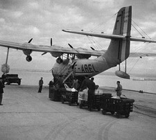 Personnel loading parcels luggage into hold of an aircraft Marigna- Old Photo 2 picture