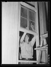 Lake Dick Arkansas 1938 Cooperative Member Installing Window in General Store picture