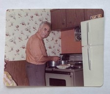 Vintage Photo 1970s Man Cooking at Stove Retro Kitchen Decor Wallpaper Snapshot picture