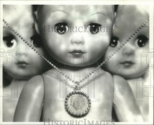 1994 Press Photo Trendy dead-baby necklace and dolls picture