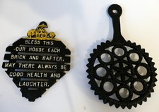2 Vintage Cast Iron Trivets, on legs, hanging hook picture