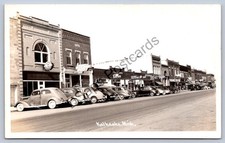 K65/ Kalkaska Michigan RPPC Postcard c1950s Main Street Stores Autos  111 picture