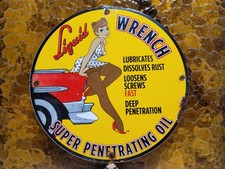 VINTAGE LIQUID WRENCH PORCELAIN SIGN GARAGE CAR TOOL LUBRICANT RUST WOMAN LADY picture