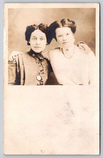 2 Women Portrait Locket Fleur-delis Pin high-collared dress ruffled Details RPPC picture