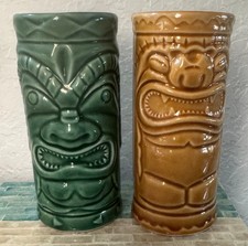 Pair 2001 Accoutrements ceramic Tiki tumblers in green & tan 5 1/2