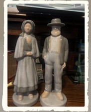 Pair of vintage porcelain figurines depicting a Amish Man And Women picture