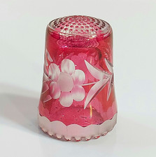 Vintage etched cranberry glass thimble featuring a delicate floral motif.  picture