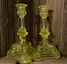 Vaseline glass dolphin candlestick holders. Super rare find picture