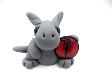 Gray dragon with a large red eye picture