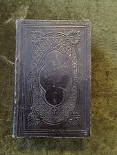 This antique book is a Deutsches Gesangbuch (German Hymnal). picture