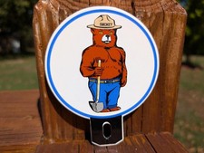 PORCELAIN SMOKEY THE BEAR LICENSE CAR TRUCK PLATE TOPPER FOB SIGN PREVENT FIRES picture