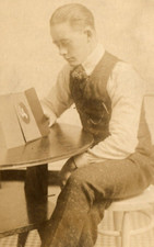 C.1910 RPPC PIP YOUNG MAN LOOKING AT PHOTO, MOURNING ? WATCH FOB Postcard P37 picture