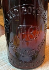 ANTIQUE OAKLAND BOTTLING CO. OAKLAND, CAL. BLOB TOP BEER, MONOGRAM IN SLUG PLATE picture