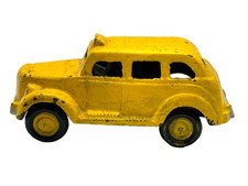 Vintage Cast Iron Taxi Driver Yellow Cab Toy with Man Driving picture