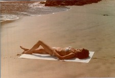1970s Barefoot Woman Sunbathing on Sandy Beach - Amateur Color Photograph picture