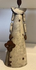 VTG decorative rustic metal sculpture of a stylized figure holding a large key. picture