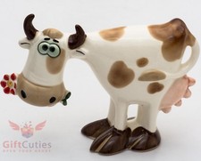 Porcelain Figurine of Cow with the flower picture