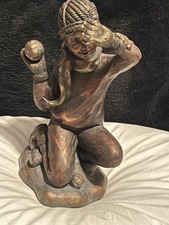 Figurine Of Child Kneeling Throwing A Snowball picture