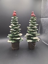 A Pair Of Cardinals Perched On Snow Covered Trees picture