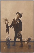 Vintage 1909  RPPC Photo Greetings Postcard Little Boy in Uniform w/ Flowers picture