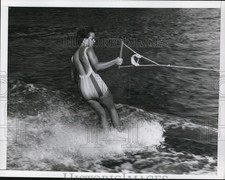 1964 Press Photo A woman water skiing behind a boat - net11704 picture