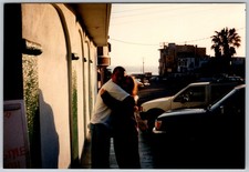 Vtg Color Snapshot Couple Hugging Golden Hour Beach Town Sunset 1990s picture