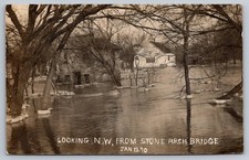 RPPC January 13 1910 Unknown Flooded Town Looking NW From Stone Arch Bridge picture