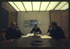 Photo:John DeLorean 1970s Boardroom Meeting Corporate Office Men Suit picture