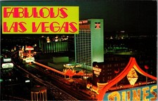 Vintage Las Vegas Strip Postcard Night View Flamingo Hilton Barbary Coast Dunes picture