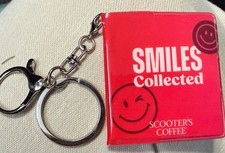 Set Of 2 - Scooters Coffee Sticker Book Keychains picture