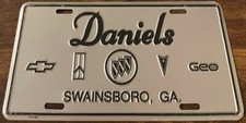 Daniels Chevrolet Olds Geo Dealership Booster License Plate Swainsboro Georgia picture