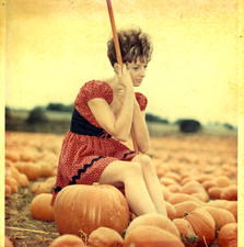 Vintage Pretty Young Woman Sitting on a Pumpkin-Half Moon Bay 1972 Snapshot picture